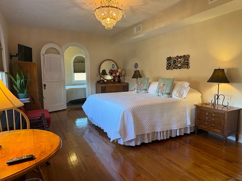 King bed, quited white bedspread, depression waterfall furniture