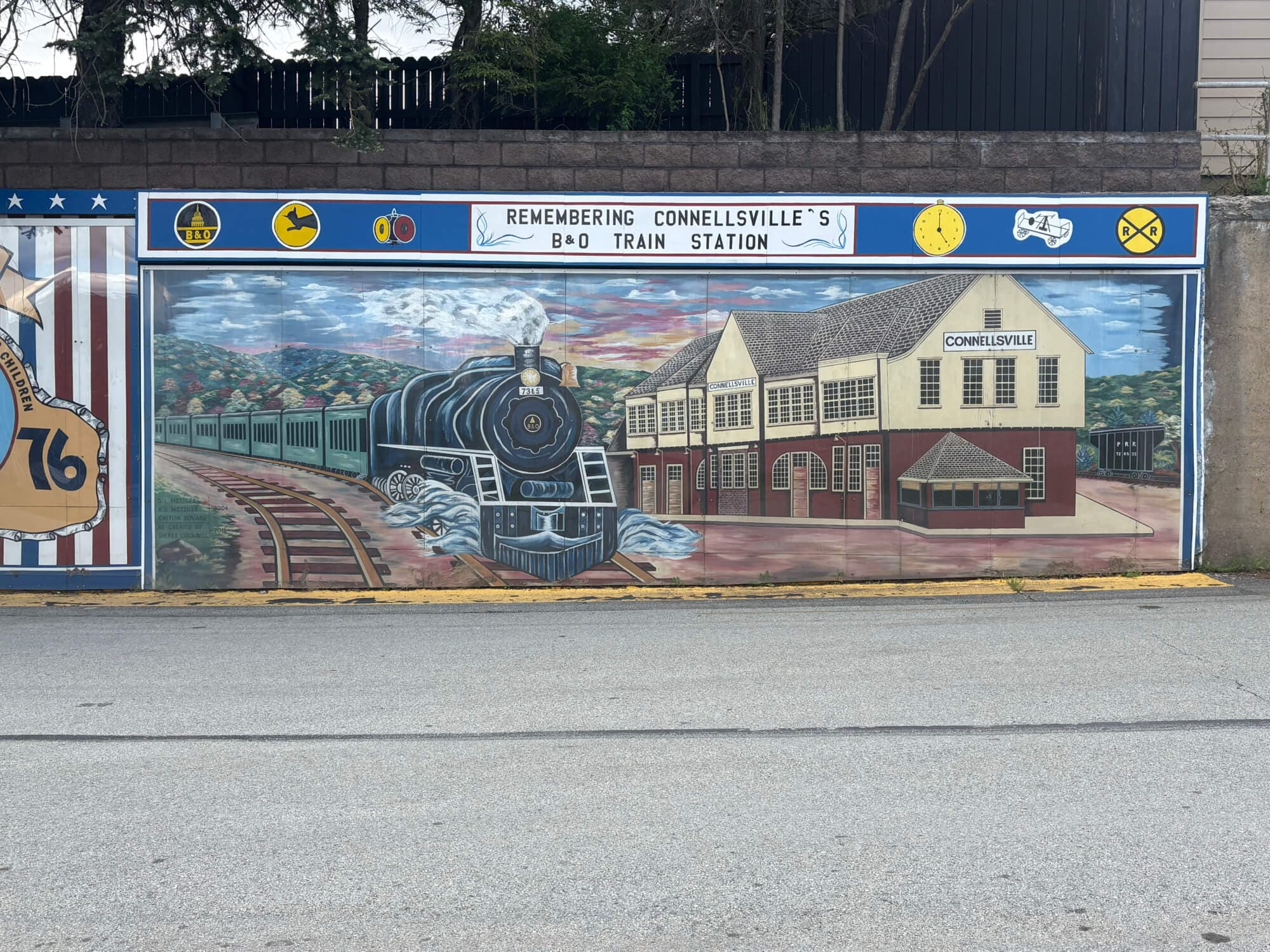 Mural commemorating Connellsville's B&O Train Station, featuring a steam locomotive and the station building.