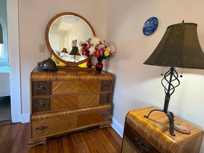 Depression Era Waterfall dresser with round mirror, WWI German helmet