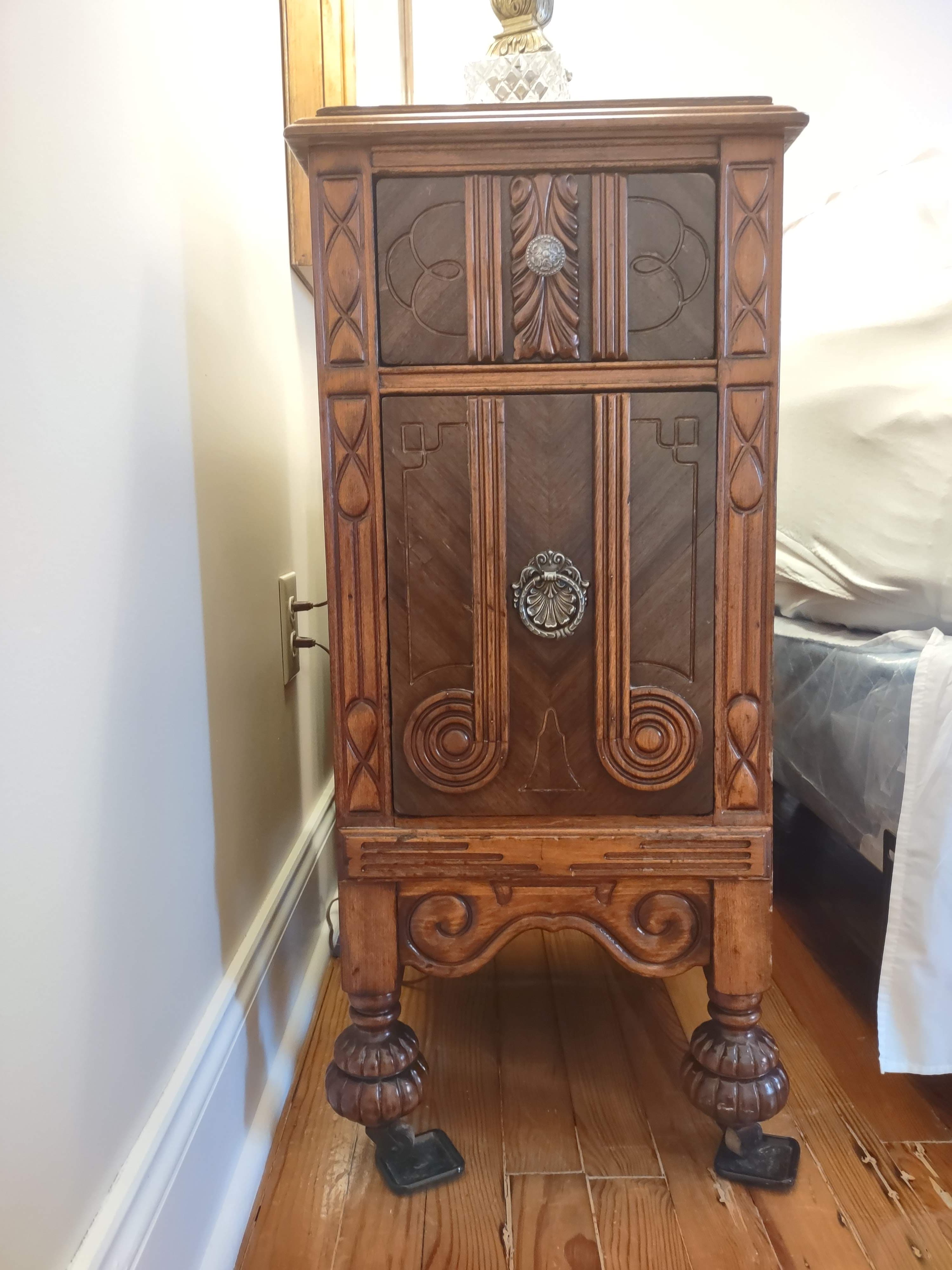 Walnut carved wood with two drawers, rollers on feet